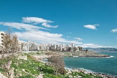 a city on the shore of a body of water at Paradise Apartment in Peiraiki in Piraeus
