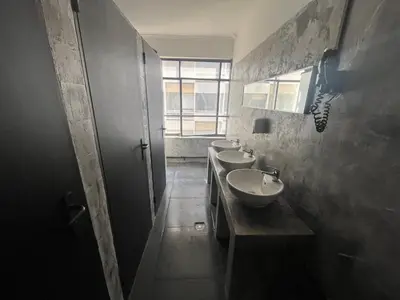 a bathroom with three sinks and a window at Urban Rooms in Athens