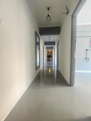 an empty hallway with white walls and a white floor at Urban Rooms in Athens