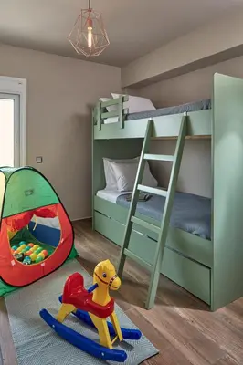 a childs room with a bunk bed and a toy at 18 Micon Str. in Athens