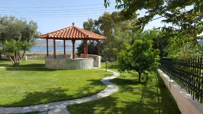 a gazebo in a park with a path at Villa Christina in Anavissos