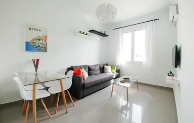 a living room with a couch and a table at KYMA Apartments - Athens Acropolis 6 in Athens