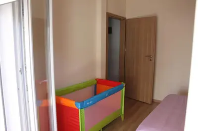 a room with a colorful crib in the corner of a room at Apartment in the Centre of Athens in Athens