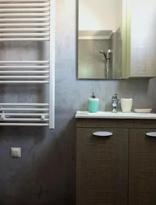 a bathroom with a sink and a mirror at Apartment in the Centre of Athens in Athens