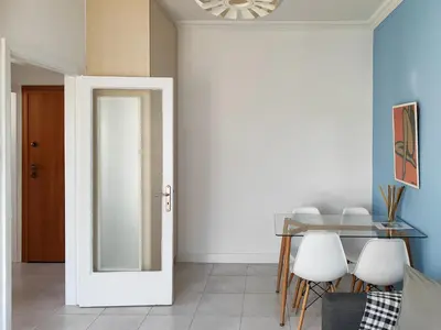 a dining room with a glass table and a mirror at KYMA Apartments - Athens Acropolis 3 in Athens
