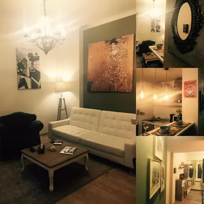 a living room with a white couch and a table at Vintage Apartment in the Heart of Plaka in Athens