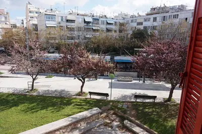 a view of a park with benches and trees at KYMA Apartments - Athens Acropolis 1 in Athens