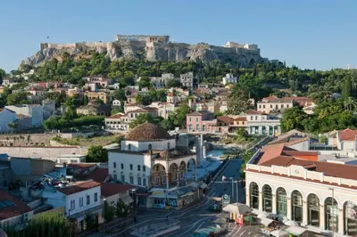 an aerial view of a town in front of the acropolis at Hidesign Athens Plaka Apartment in Acropolis in Athens