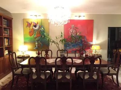 a dining room with a table and a chandelier at Athens Lycabettus Hill Penthouse, Private Roof Garden & Pool in Athens