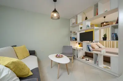 a living room with a couch and a table at Boutique Apartments in Athens in Athens