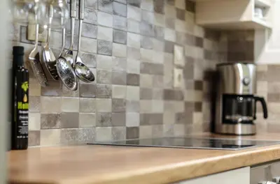 a kitchen counter with a stove top in a kitchen at Boutique Apartments in Athens in Athens