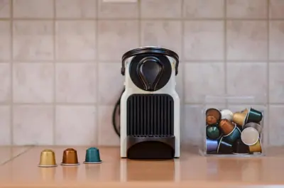 affeepot sitting on top of a counter with a group of toys at Boutique Apartments in Athens in Athens