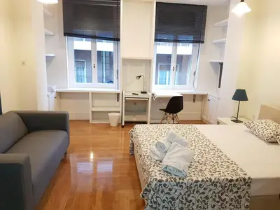 a living room with two beds and a couch at Errathens Aegean Apartment - Athens Center, 5 BD, 2 BATH in Athens
