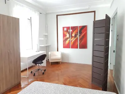 an office with a desk and a chair in a room at Errathens Pine Red and Taupe - Athens Center in Athens