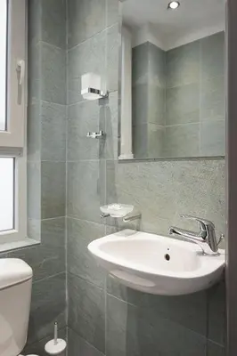 a bathroom with a sink and a toilet at Acropolis Elegant Penthouse in Athens