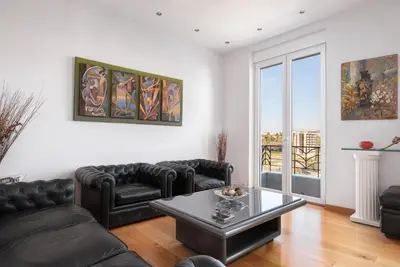 a living room with a couch and a coffee table at Acropolis Elegant Penthouse in Athens