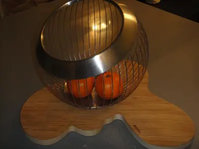 a basket full of pumpkins sitting on top of a guitar at Soho Athene Apartment in Athens