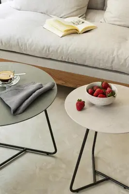 a table with a bowl of strawberries on it next to a bed at Syntagma Square Modern Apartments in Athens