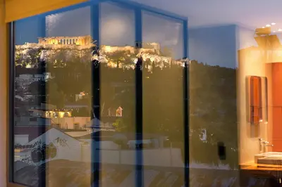 a view of the acropolis from a window of a bathroom at Acropolis View Luxury Apartment in Athens