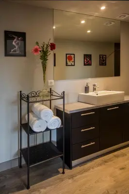a bathroom with a sink and a mirror at Athens Suites in Athens