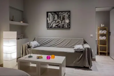a living room with a couch and a table at Athens Suites in Athens