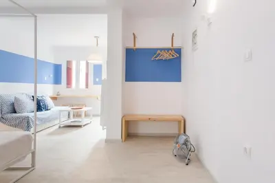 a living room with a couch and a table at Karitsi Place in Athens