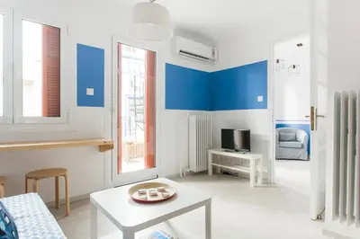 a living room with blue and white walls at Karitsi Place in Athens