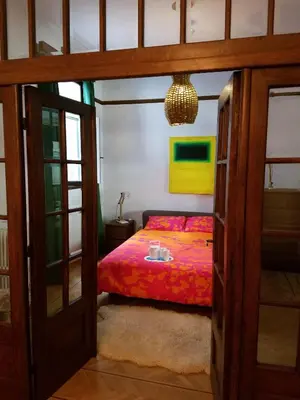 a bedroom with a bed with a table on it at Kolonaki Deco Apartment in Athens