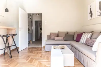 a living room with a couch and a table at Muses Residence in Athens