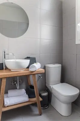 a bathroom with a sink and a toilet at Muses Residence in Athens
