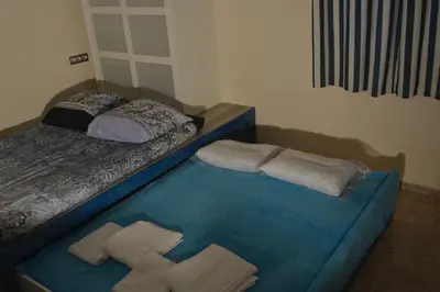 a bedroom with two beds with towels on the floor at Cosy apartment Acropolis Point-3 in Athens