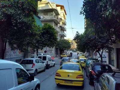 a bunch of cars parked on a city street at Cosy apartment Acropolis Point-3 in Athens