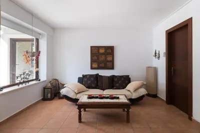 a living room with a couch and a coffee table at Villa Saronida in Saronida
