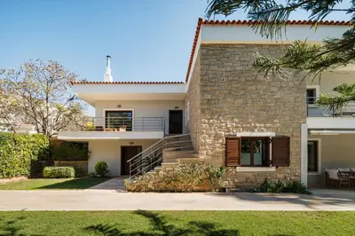 a rendering of a house with a stone facade at Villa Saronida in Saronida