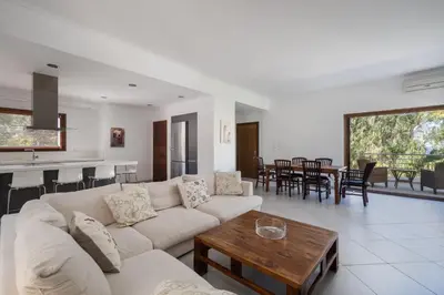 a living room with a couch and a table at Villa Saronida in Saronida