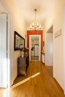 a hallway with a mirror and a dresser in a room at Acropolis Neoclassical Mansion by YHA in Athens
