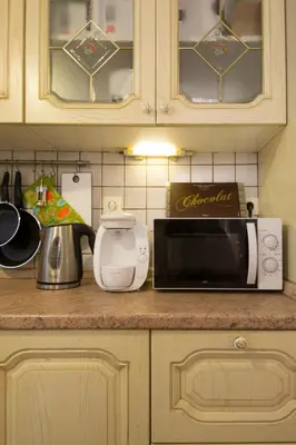 a kitchen counter with a microwave and a toaster at Acropolis Neoclassical Mansion by YHA in Athens