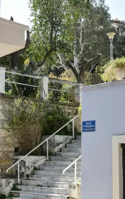 a set of stairs with a tree in the background at Miranda's Apartment in Thissio in Athens