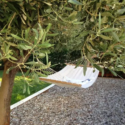 a white hammock sitting under a tree at Saronida Boutique Villa Private Pool, Sea views, Lovely Gardens & Roof Terrace in Saronida