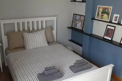 a bedroom with a bed with towels on it at Illisia Roof Apartment in Athens