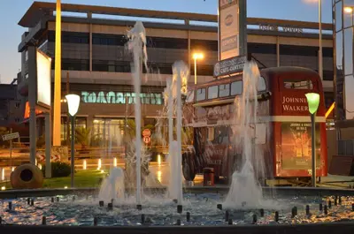 a fountain with water in front of a building at Blue Ark Athenian Nest in Athens