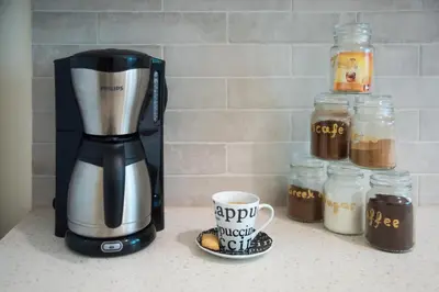 a coffee maker and a cup of coffee on a counter at Blue Ark Athenian Nest in Athens