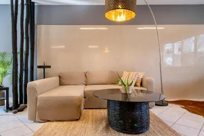 a living room with a couch and a table at Comfort Stay Lofts in Athens