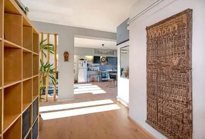 a hallway with a large wooden door in a house at Comfort Stay Lofts in Athens