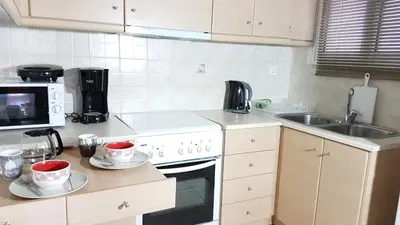 a kitchen with a sink and a stove top oven at Errathens Wheat Apartment - Athens Center, 3 BD, 1 BATH in Athens