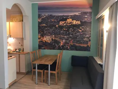 a dining room with a view of a city at Flat31 in Athens