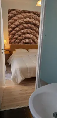 a bedroom with a white bed and a sink at Flat31 in Athens