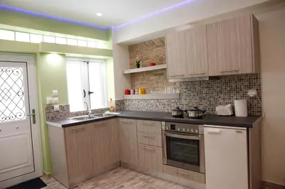a kitchen with a sink and a stove top oven at George Studio in Athens