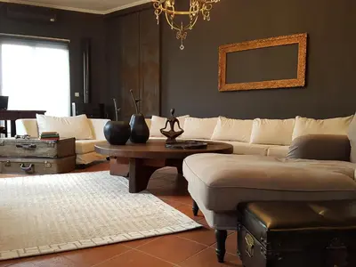 a living room with a couch and a table at ADMETUS PSYRRI LOFT by K&K in Athens