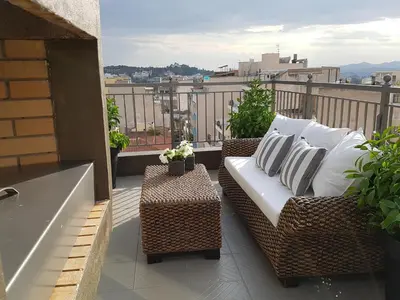 a balcony with a couch and a table at ADMETUS PSYRRI LOFT by K&K in Athens